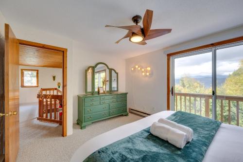 a bedroom with a bed and a ceiling fan at Mountain-View Jackson Hideaway with Deck! in Jackson