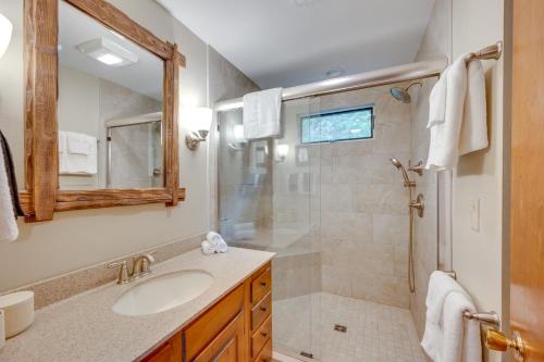 a bathroom with a shower and a sink and a mirror at Mountain-View Jackson Hideaway with Deck! in Jackson