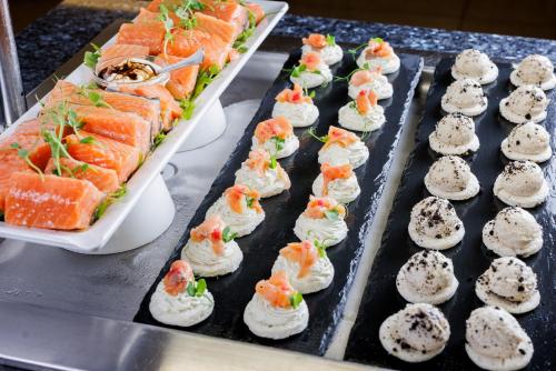 a tray filled with sushi on a table at Hotel Slovenija - Terme & Wellness LifeClass in Portorož
