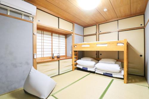 a room with two bunk beds in it at Samp,Inn - Vacation STAY 27372v in Fukuoka
