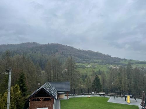 a skate park in front of a mountain at Willa Nad Wodospadem in Szczawnica