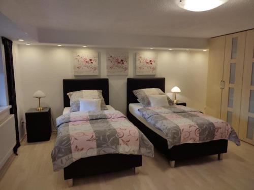 Ein Bett oder Betten in einem Zimmer der Unterkunft Gästewohnung Mühlstein