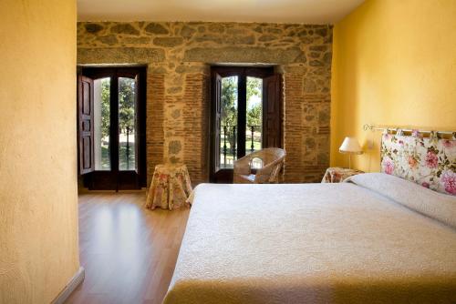 Postel nebo postele na pokoji v ubytování Hotel Balneario Almeida Dama Verde