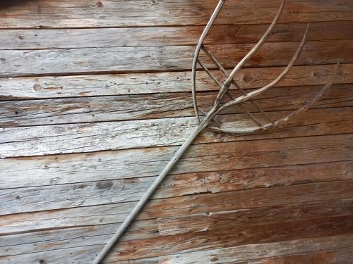 a ladder hanging from a wooden wall at Scheffauerhof in Scheffau am Wilden Kaiser