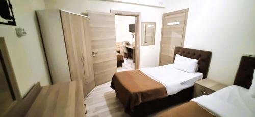 Katil atau katil-katil dalam bilik di WİND HOTEL