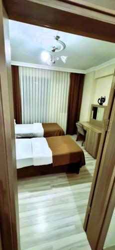 Katil atau katil-katil dalam bilik di WİND HOTEL