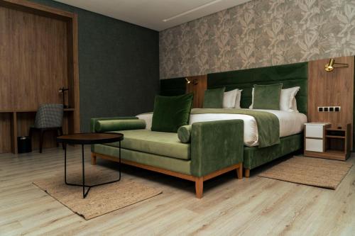 Postel nebo postele na pokoji v ubytování Hotel Ben Batouta - Tanger