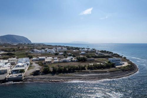 an aerial view of an island in the ocean at New Sea Serenity Villas Next to the Sea With Private Jacuzzi in Vlychada