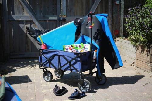 a blue baby stroller with a bat costume on it at The Cabin At The Beach in Seasalter