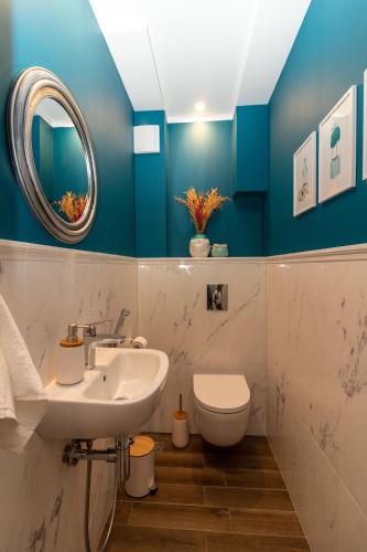 a bathroom with a sink and a toilet at Contemporary Charm in Old Sofia in Sofia