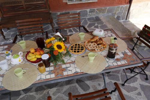 a table with a bunch of food on it at Agriturismo val di Coreto in Bagnoregio