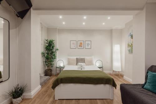 Posteľ alebo postele v izbe v ubytovaní Kensington Nest Flat