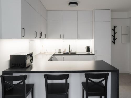 Kuchyňa alebo kuchynka v ubytovaní Apartament Smart Kamienica Grochów with free parking
