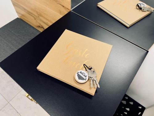 a table with a card and a pair of scissors at Ferienwohnung Traum am Berg in Zwiesel