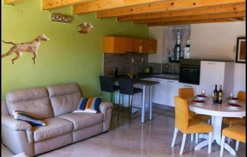 a living room with a couch and a dog on the wall at House Barbara in Lastovo