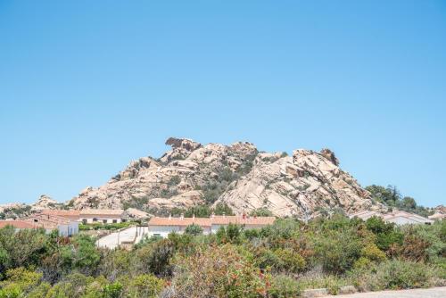 a mountain with a house on top of it at Appartamento Palau Sole in Palau