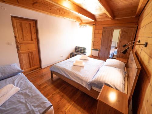 Postel nebo postele na pokoji v ubytování SKI CIERNY BALOG