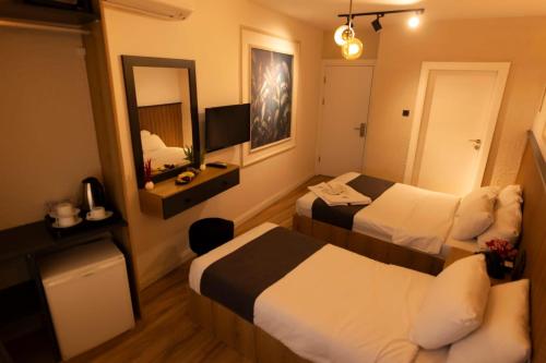 Ένα ή περισσότερα κρεβάτια σε δωμάτιο στο işbilir hotel