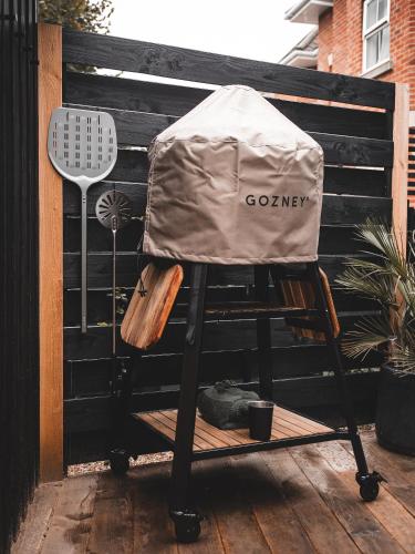 a covered high chair sitting on a deck at Deus Ex Machina Hotel in Bournemouth
