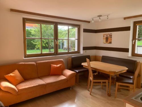 a living room with a couch and a table at Haus Ulli in Radstadt