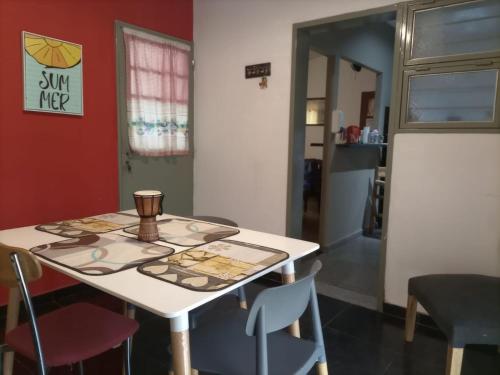 a table and chairs in a room at Casa Norte in La Rioja