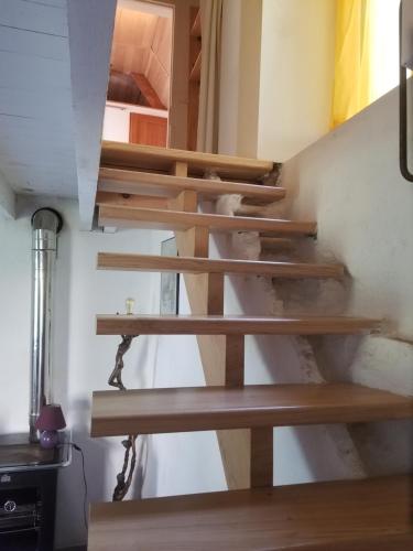 Μία ή περισσότερες κουκέτες σε δωμάτιο στο Maisonnette dans un écrin de pierre et de verdure