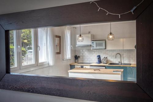 a kitchen with a sink and a counter top at Blue Prosper - Centre-Ville in Grenoble