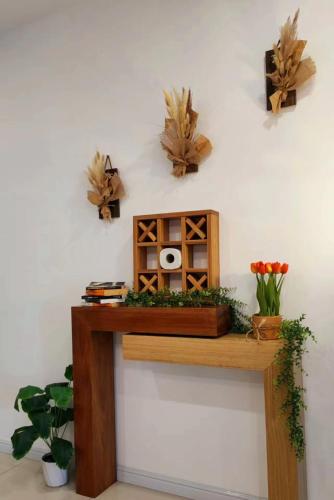 a wooden shelf with a radio on a wall at Ipoh Homestay - Manhattan Condominium with Water Park & Leisure Facilities in Ipoh