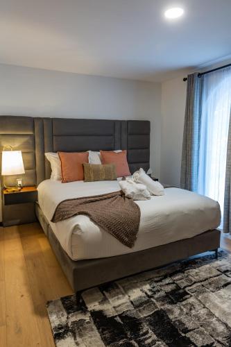 a bedroom with a large bed with orange pillows at Casa Castillo in Mexico City