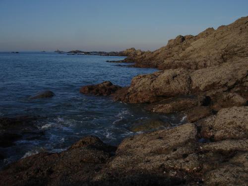 a group of rocks on the shore of the ocean at Chambres d'hôtes Logis Du Jerzual in Dinan