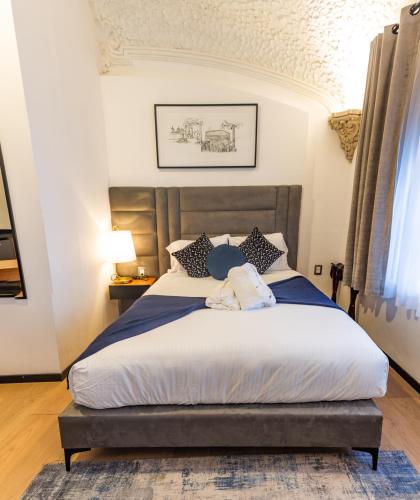 a bedroom with a large bed in a room at Casa Castillo in Mexico City