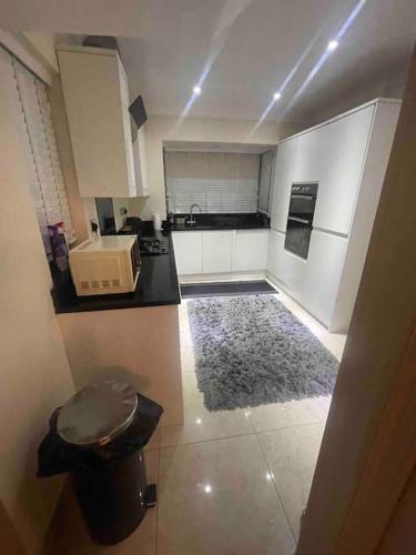 an overhead view of a kitchen with a counter top at Lovely Detached house in lovely location in West Drayton