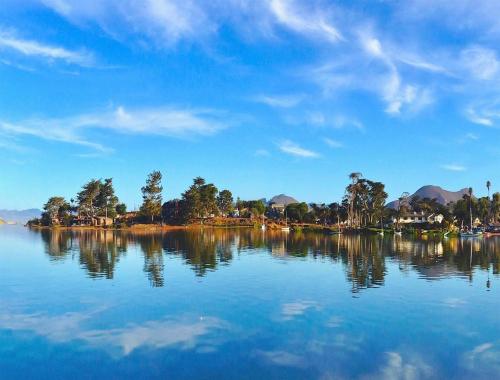 a large body of water with trees and houses at Back Bay Inn in San Luis Obispo