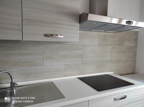 a kitchen with a sink and a stove at La Casa di Dany in Rome