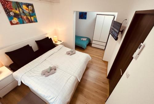 a small bedroom with two beds in a room at Apartment In Time in Sesvete