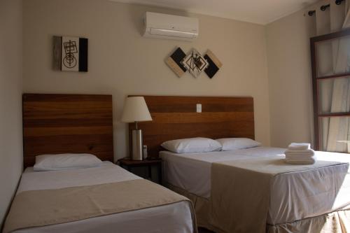 Katil atau katil-katil dalam bilik di Hotel Dona Paschoalina
