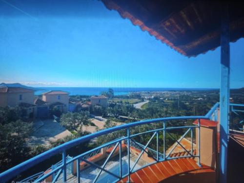 a view of the ocean from the balcony of a house at Tapia Hills in Methoni