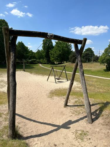 an old swing set in a park at Haus Haddorfer See "Hus vi d Sjön" in Wettringen