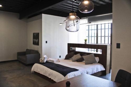 Vuode tai vuoteita majoituspaikassa Loft titanio en excelente ubicación!