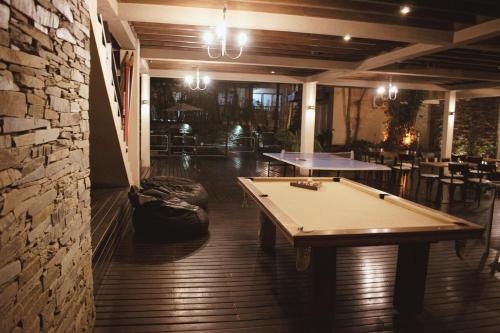 a pool table in the middle of a room at Sonidos Del Bosque in Mar de las Pampas