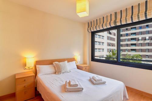 Posteľ alebo postele v izbe v ubytovaní Metropolitan Apartment