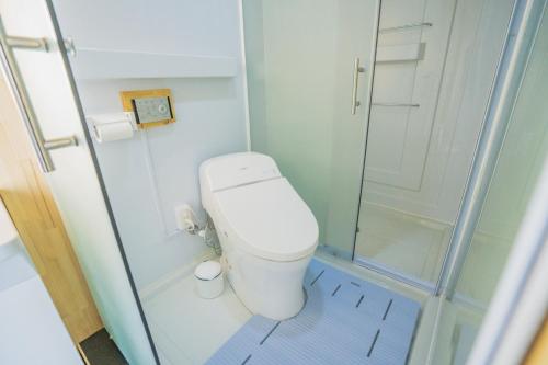 a small bathroom with a toilet and a shower at Izu coco dome tent Ⅾ - Vacation STAY 90004v in Ito