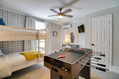 a bedroom with bunk beds and a ping pong table at Cozy Virginia Home in Lynchburg Historic District! in Lynchburg