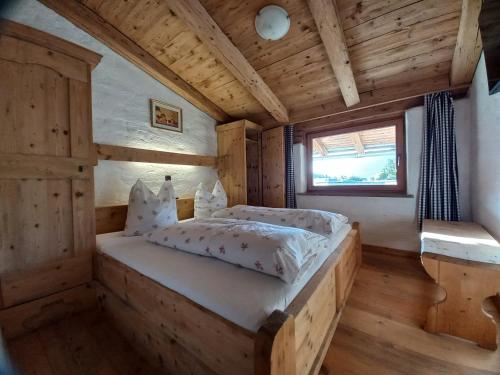 Postel nebo postele na pokoji v ubytování Scheffauerhof