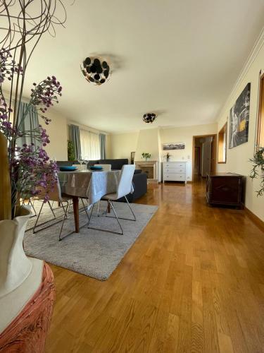 a living room with a table and a couch at Holiday Flat Green Coast in Espinho