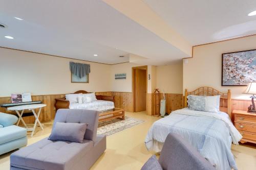 a bedroom with two beds and a couch and a desk at West Virginia Home with Deck on Golf Course in Hedgesville