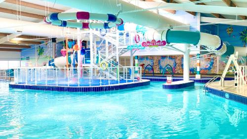 a large indoor water park with a water slide at LillyPad Caravan in Selsey