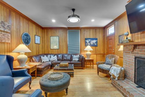 a living room with a couch and a fireplace at Danville Retreat with Hot Tub and Cozy Fireplace! in Danville