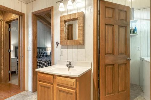 a bathroom with a sink and a mirror at 2600 Linden View Drive By Sarah Bernard Vacation Rentals in Innsbrook