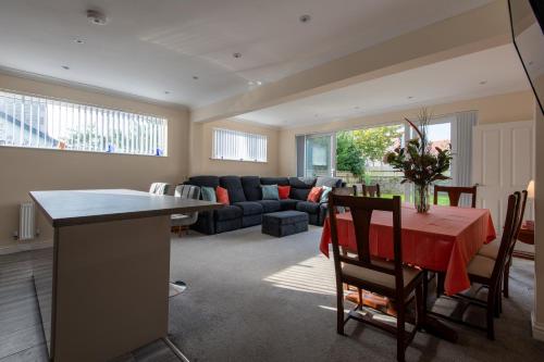 a living room with a table and a couch at Seaview Cottage in Cardiff